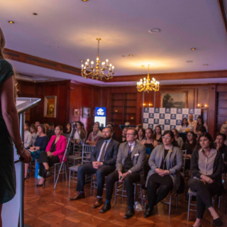 A woman making a presentation at a hotel venue