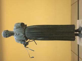 The Charioteer of Delphi, a statue surviving from Ancient Greece, and an example of ancient bronze sculpture.